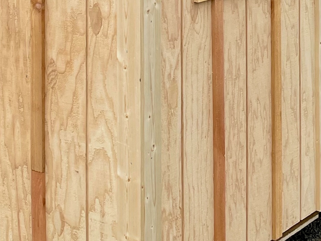wood siding on outdoor dog kennel for copy