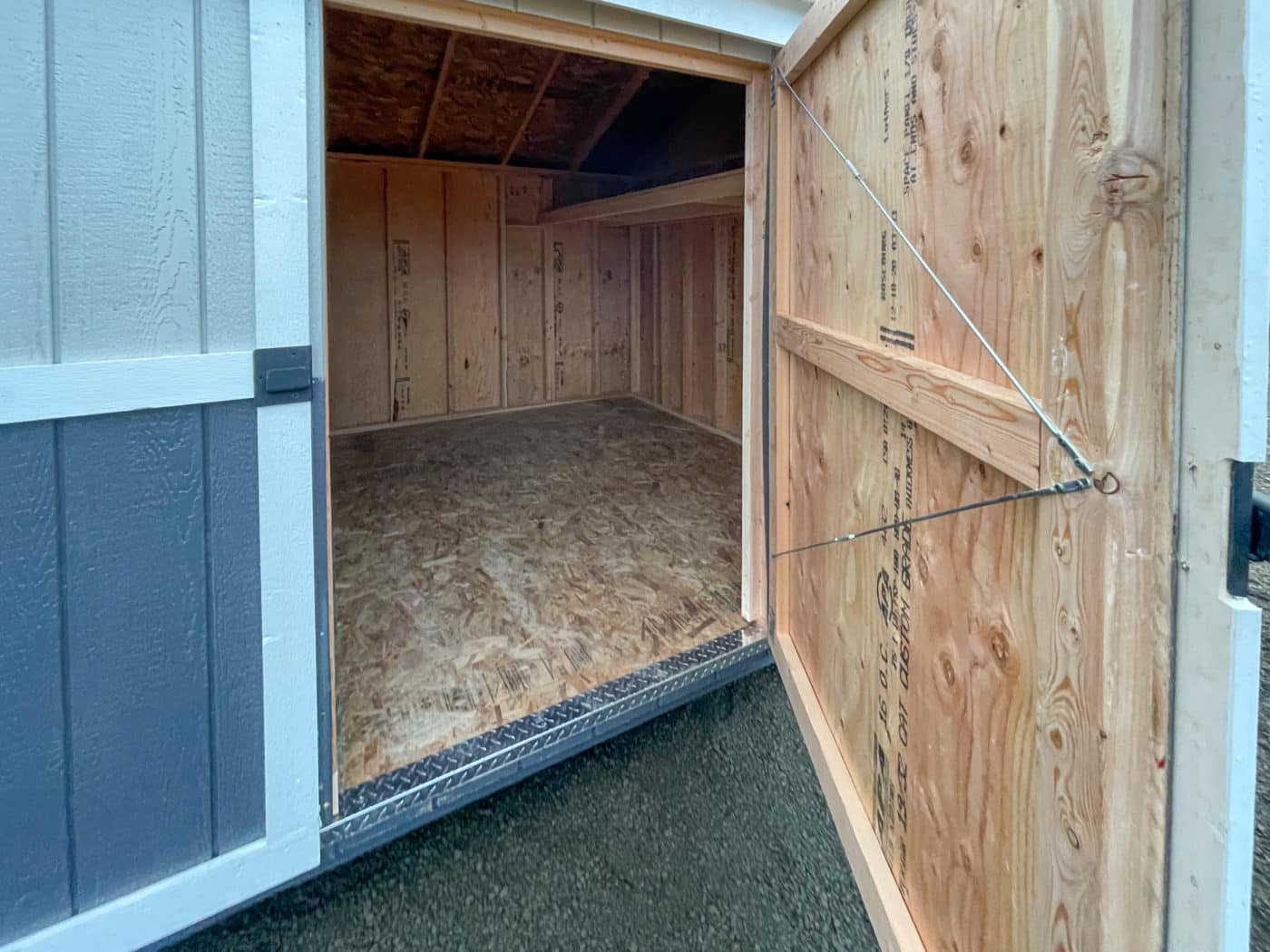 door open on storage sheds for sale in Washington Oregon northern California and western Idaho showing its wooden interior